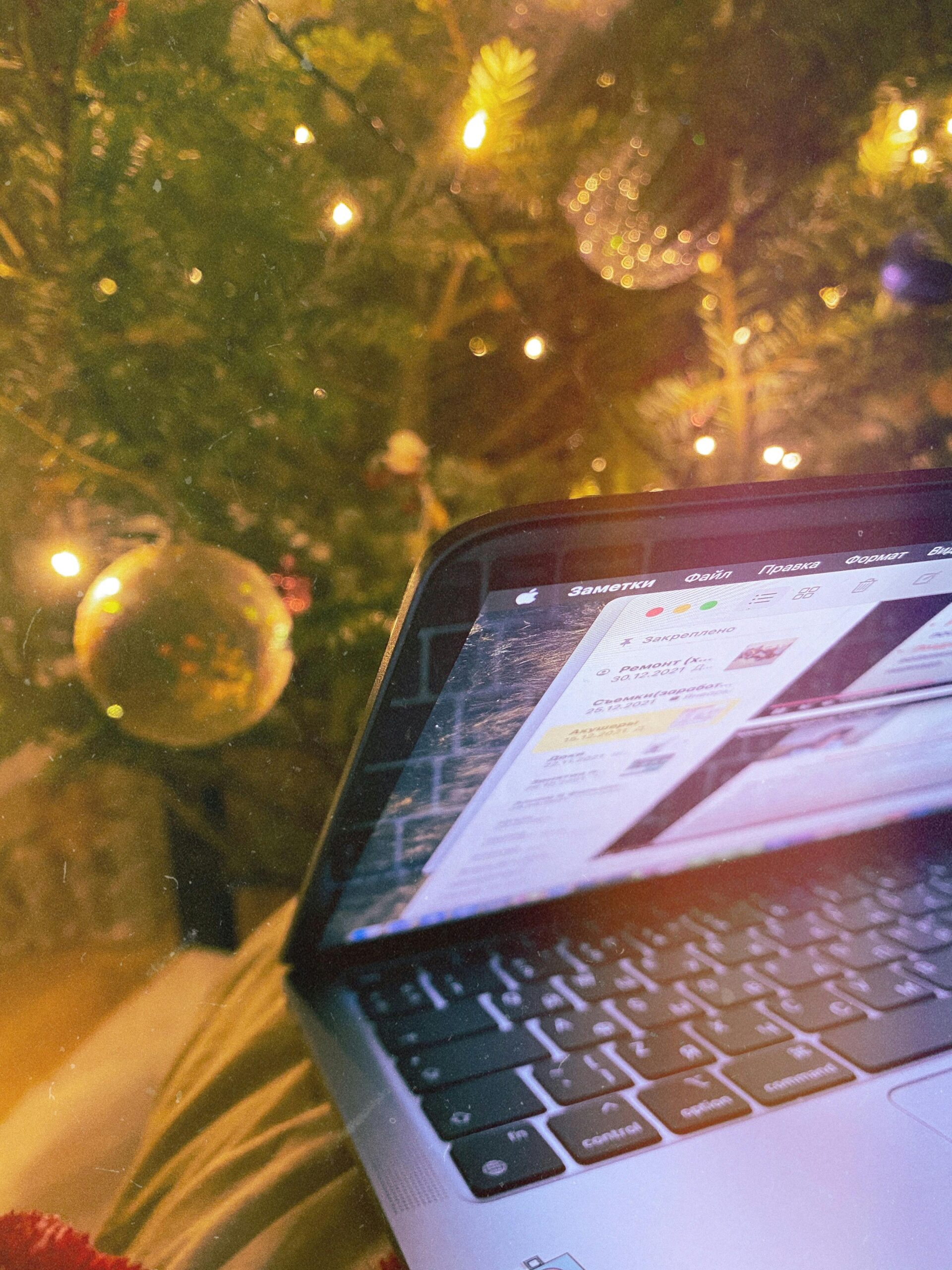 Laptop infront of a Christmas tree